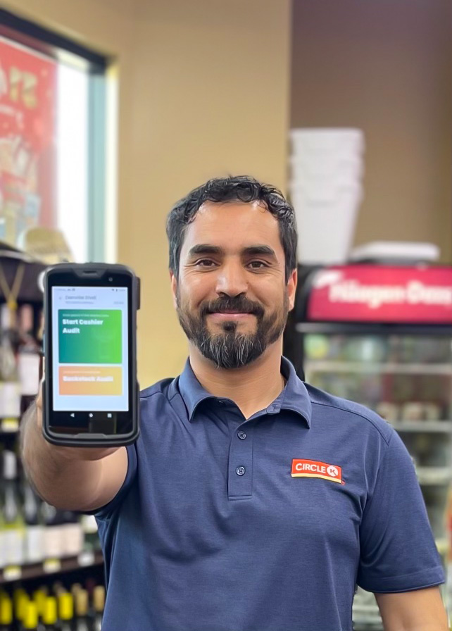LottoShield employee holding mobile device